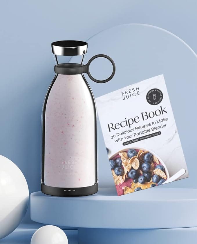 a blender bottle and a recipe book
